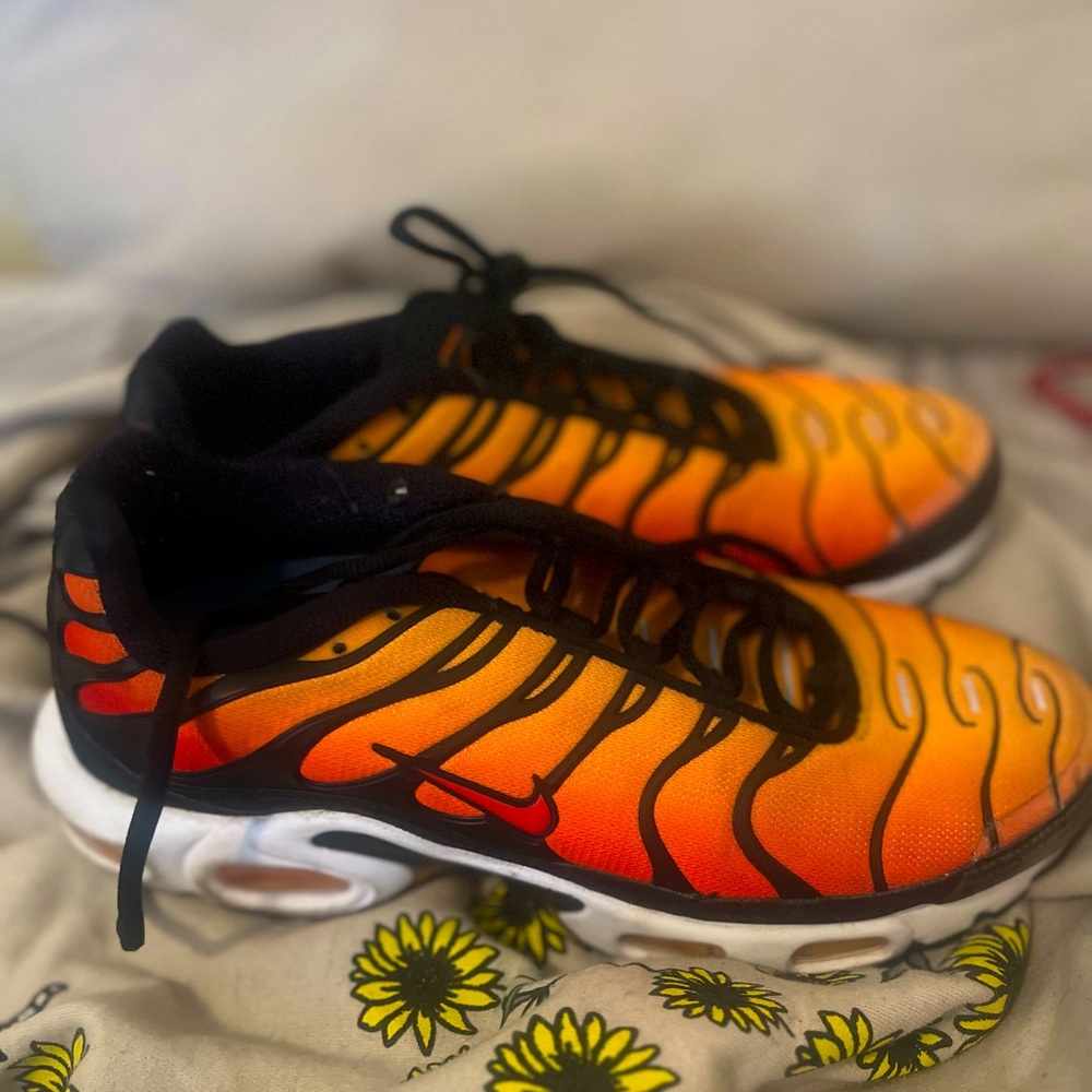 These are orange red and black size 8.5 airmaxs